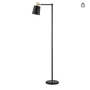 Globe lamp. Black and gold in colour. Concrete in base so it stands straight.